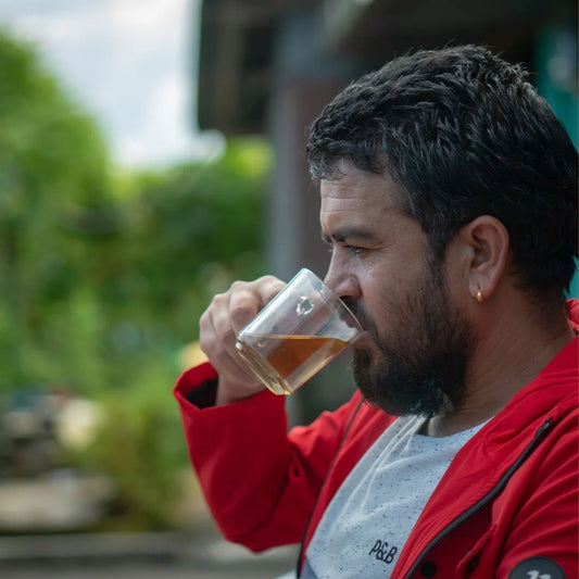 Nepali youth drinking tea during a festival