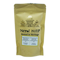 Thumbnail for A brown kraft paper resealable pouch of Nepal Hills Floral Oolong Tea. The packaging features a gold pagoda illustration, the brand name 'Nepal Hills,' and labels in English and French indicating a net weight of 25 grams.