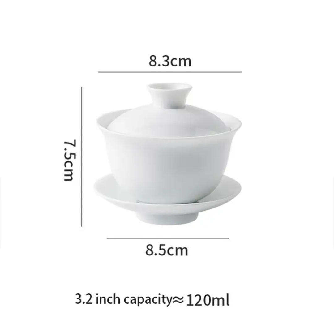 Close-up of the glazed rim of a white ceramic gaiwan