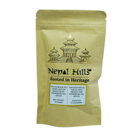 Thumbnail for A brown kraft paper resealable pouch of Nepal Hills Special Black Tea. The packaging features a gold pagoda illustration, the brand name 'Nepal Hills,' and labels in English and French indicating a net weight of 25 grams.