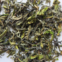 Close-up of White tea leaves on a white background